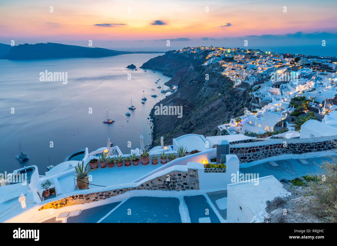 View of Oia village at sunset, Santorini, Cyclades, Aegean Islands, Greek Islands, Greece, Europe Stock Photo
