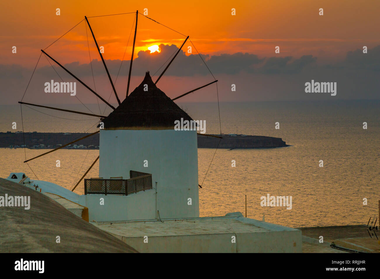 View of windmill at sunset in Oia village, Santorini, Cyclades, Aegean Islands, Greek Islands, Greece, Europe Stock Photo