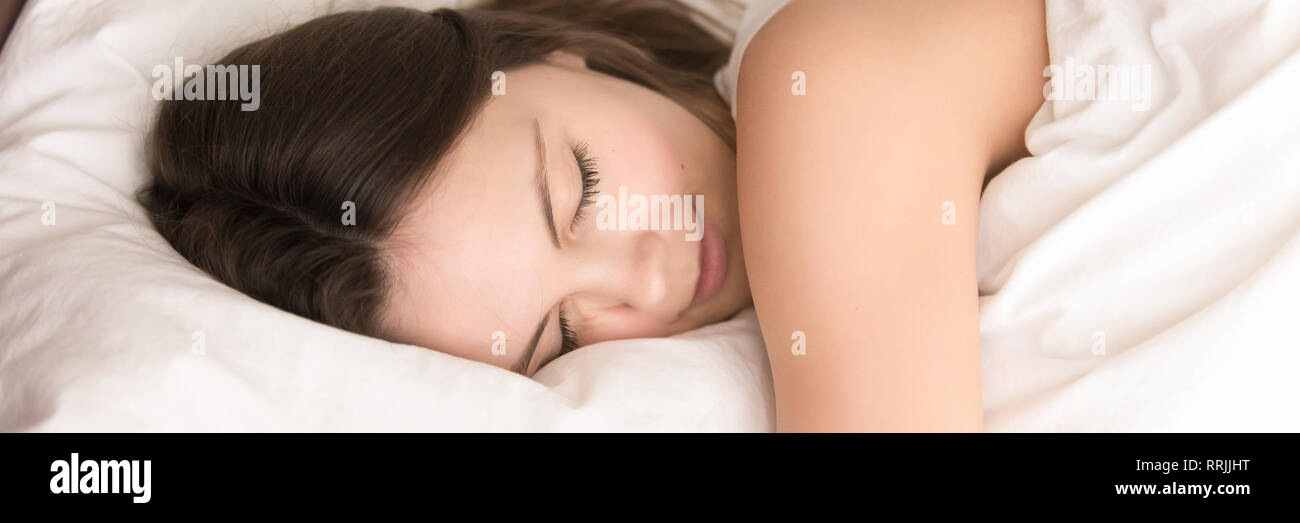 Close up woman sleeping lying in bed panoramic image Stock Photo