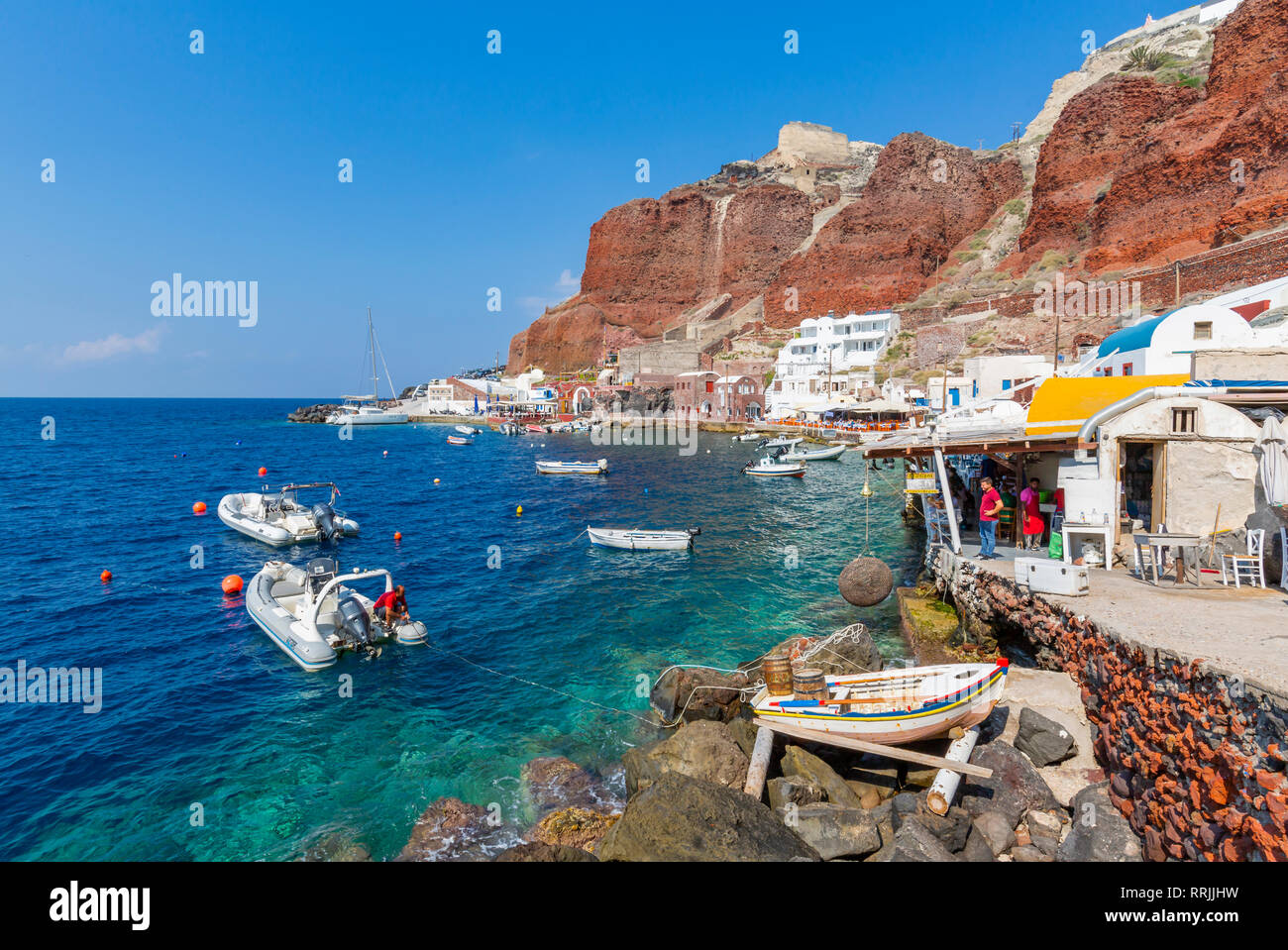 View of little harbour and clifftop Oia village, Santorini, Cyclades, Aegean Islands, Greek Islands, Greece, Europe Stock Photo