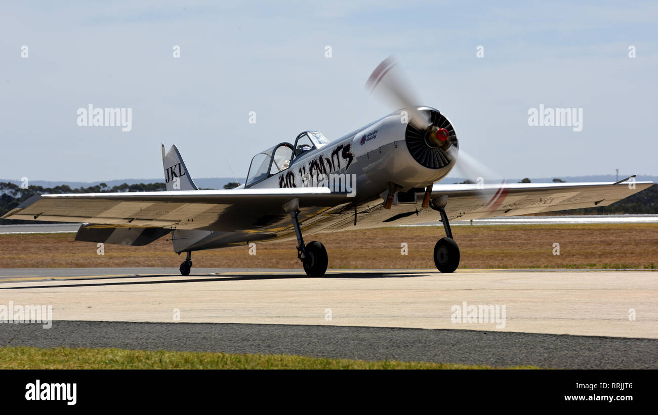 A Yak-52-TW taxis down the Avalon Airport runway after a flight at Geelong, Victoria, Australia, Feb. 25, 2019. The Yak-52TW is part of the aerial demonstration team Air Bandits and practiced aerobatic maneuvers in preparation for the 2019 Australian International Airshow and Aerospace & Defence Exposition. (U.S. Air Force photo by Staff Sgt. Sergio A. Gamboa) Stock Photo