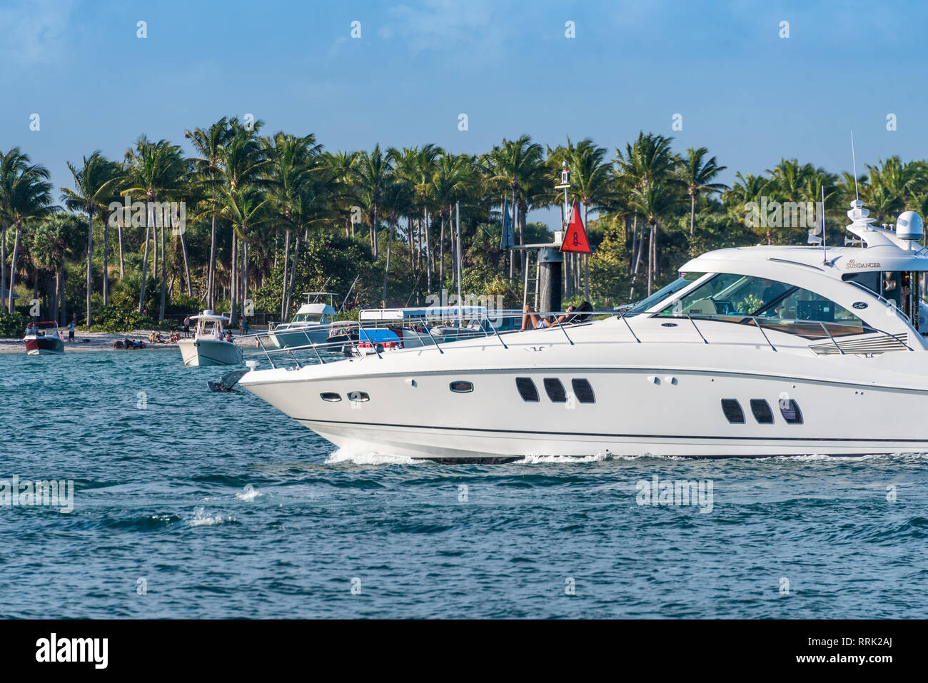 People and boats gather around Peanut Island, just off of Palm Beach in the Intracoastal Waterway at the Palm Beach Inlet in Palm Beach, Florida. Stock Photo