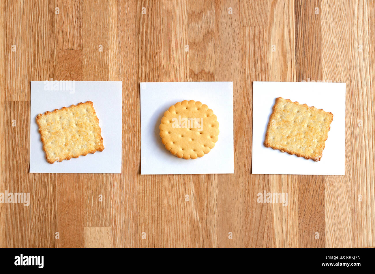 two crackers and cookies with filling, laid out on white stickers Stock