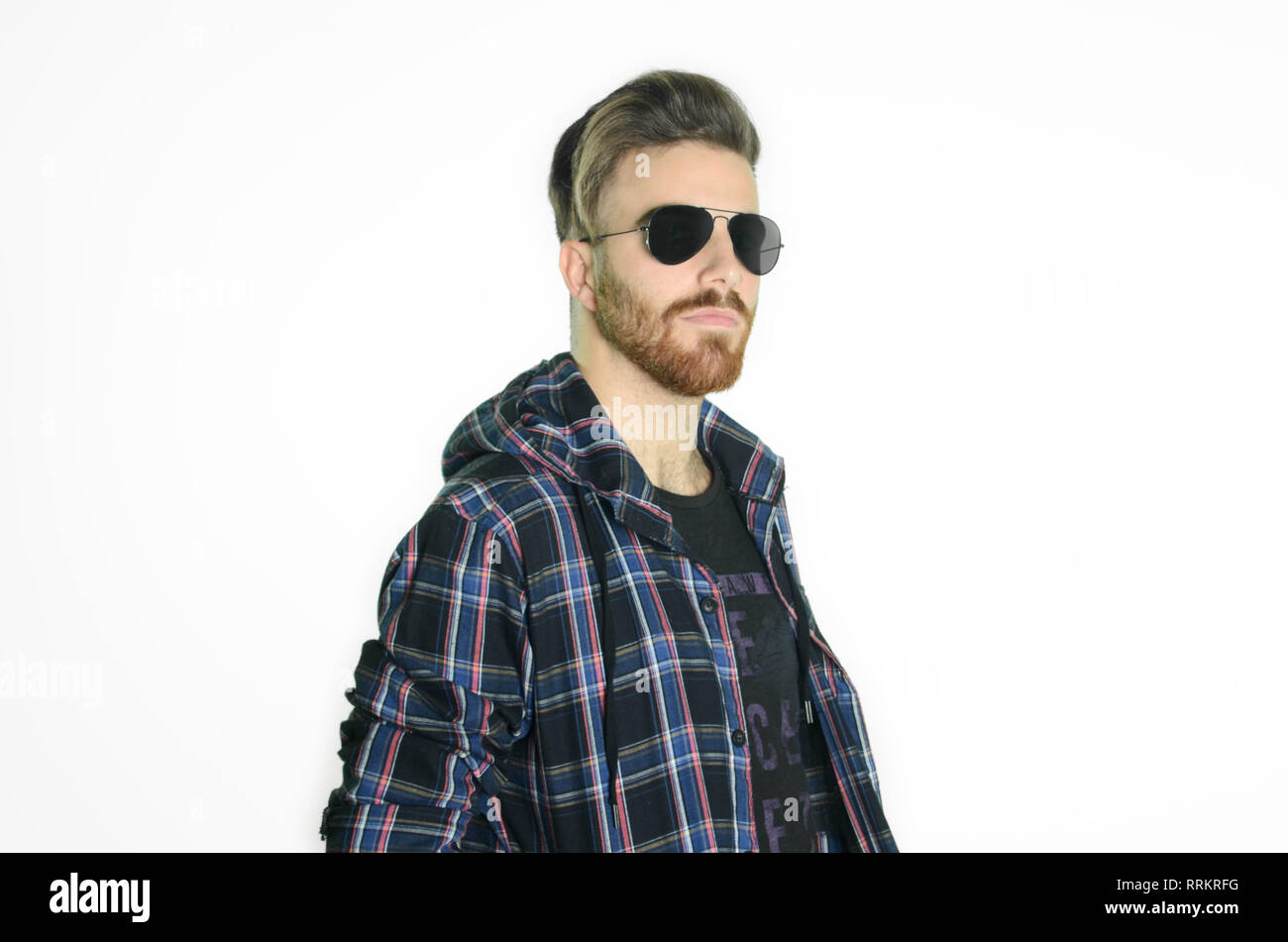 Young man posing happy and confident with sunglasses on isolated white ...