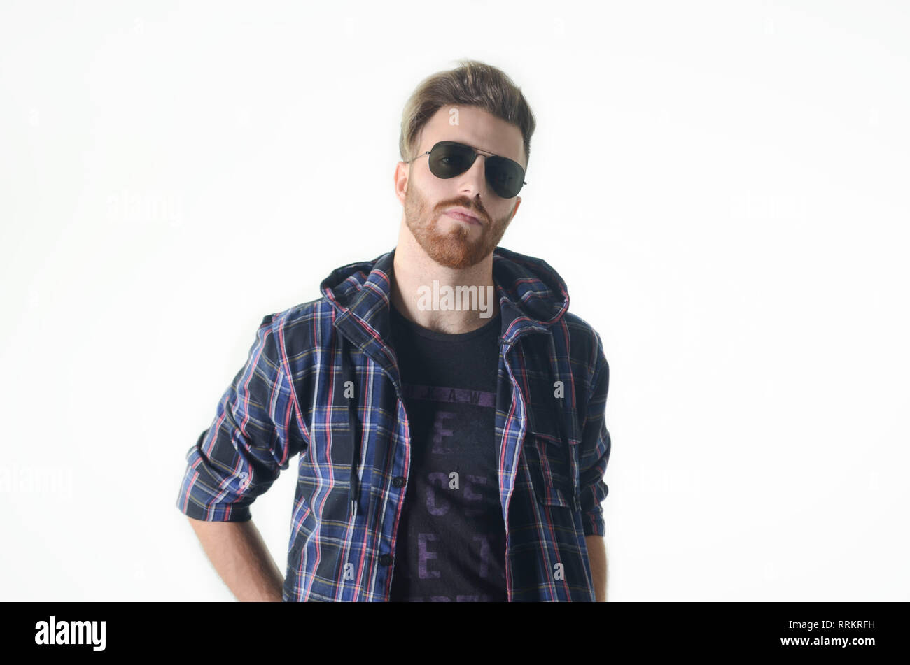 Young man posing happy and confident with sunglasses on isolated white ...