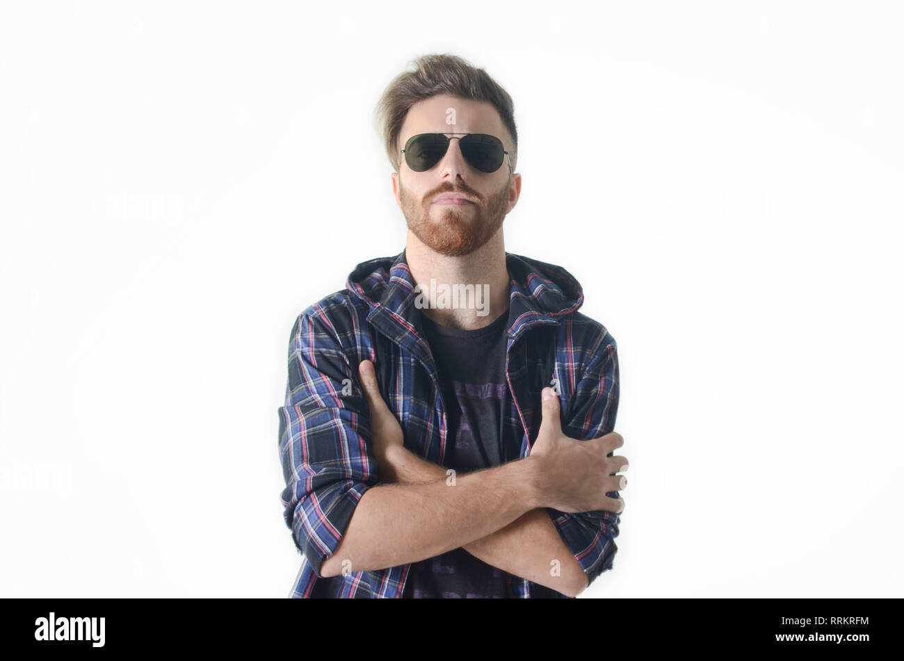 Young man posing happy and confident with sunglasses on isolated white ...