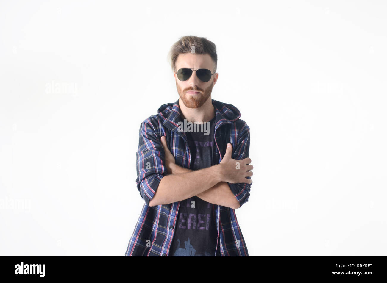 Young man posing happy and confident with sunglasses on isolated white ...