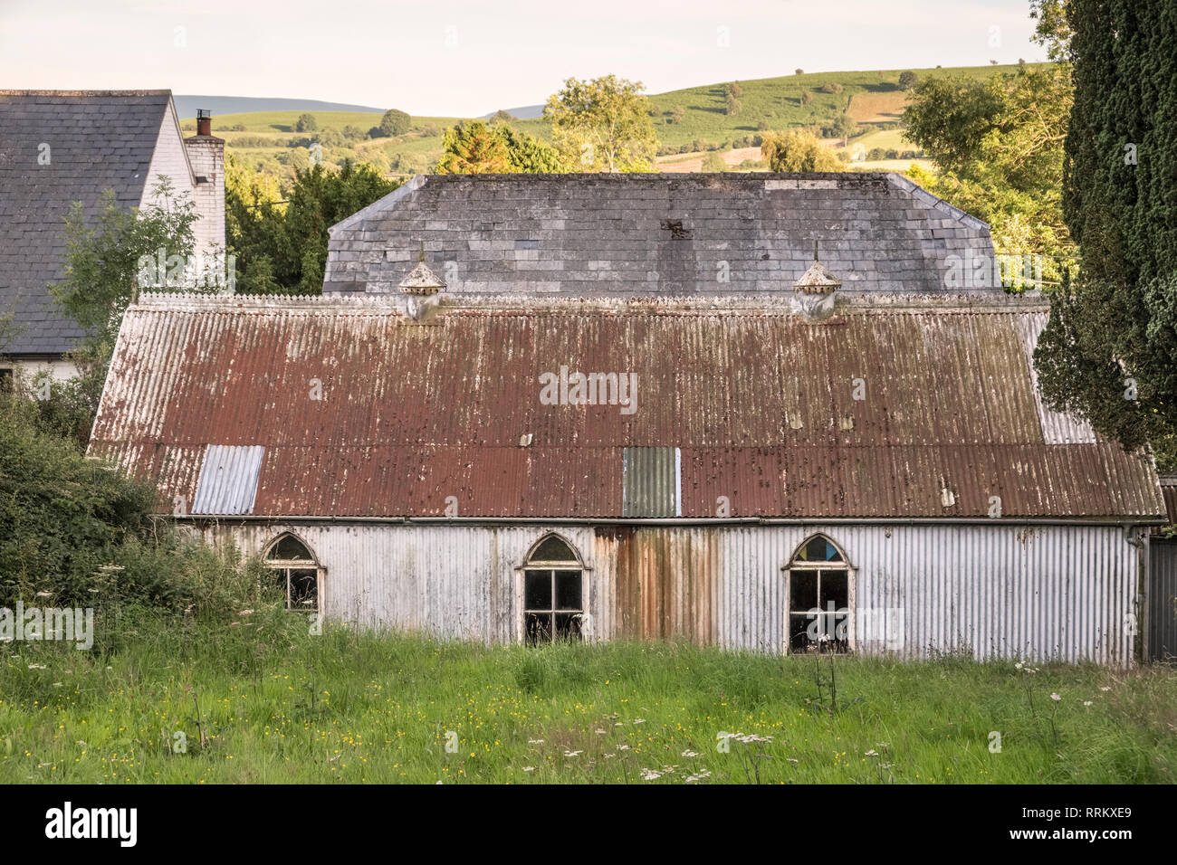 The old 19c corrugated iron village schoolroom and vestry (next to the Adullam Baptist Chapel) in Painscastle, Powys (mid Wales) Stock Photo