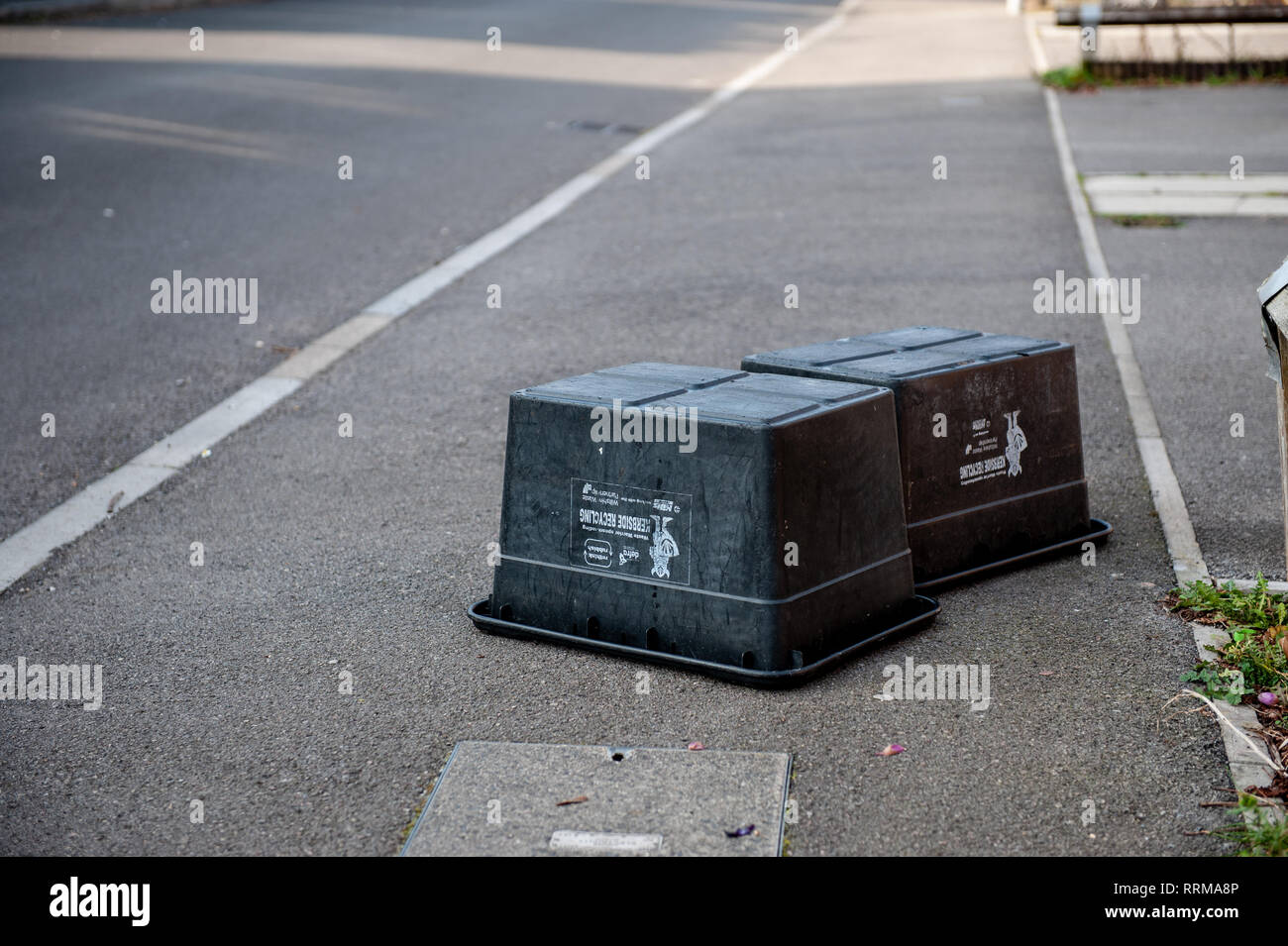 Black Box containers emptied! Local refuse collection for paper, cans and bottles. Stock Photo