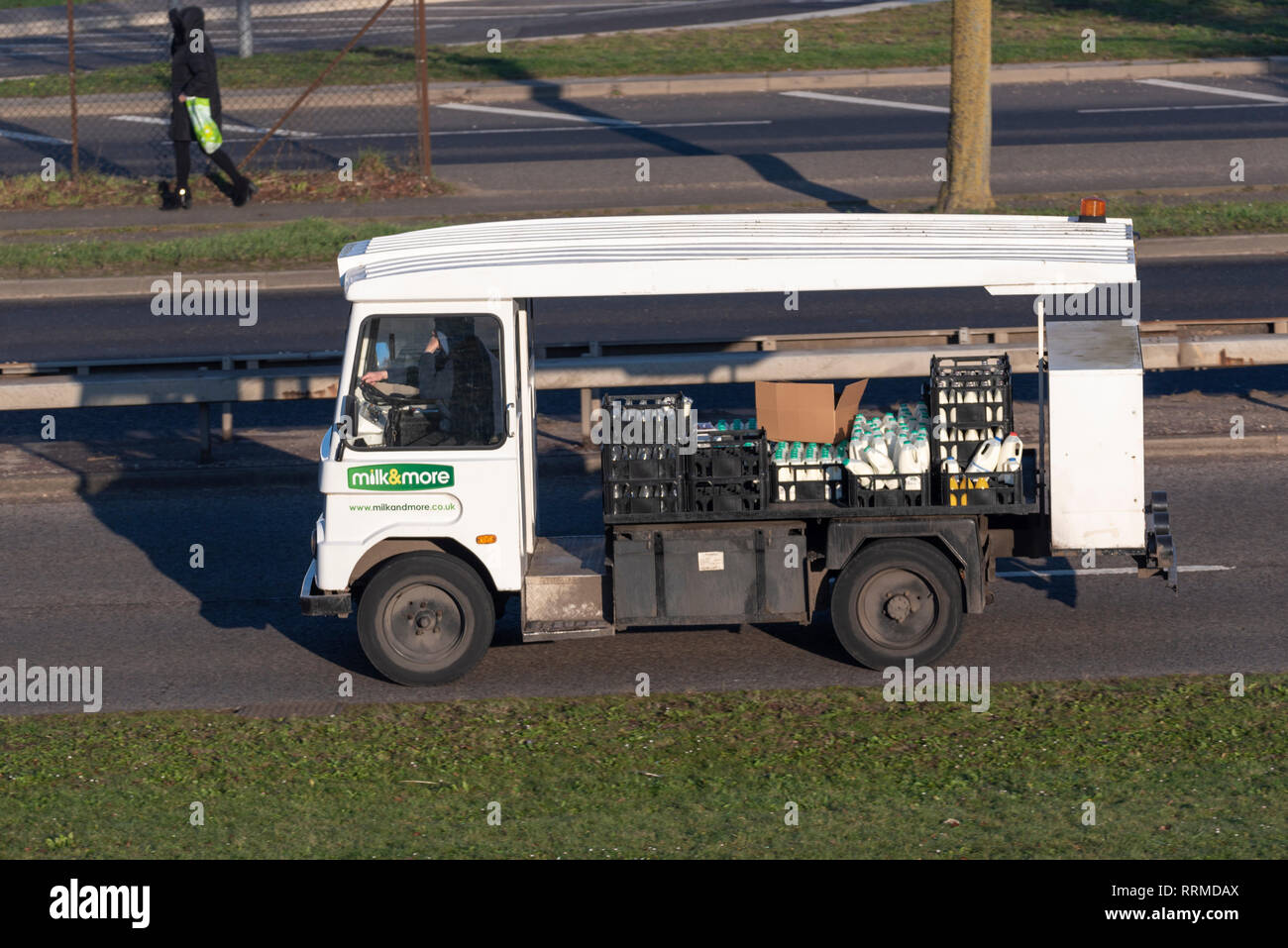 Milk & More electric milk float delivering milk. Old electric vehicle