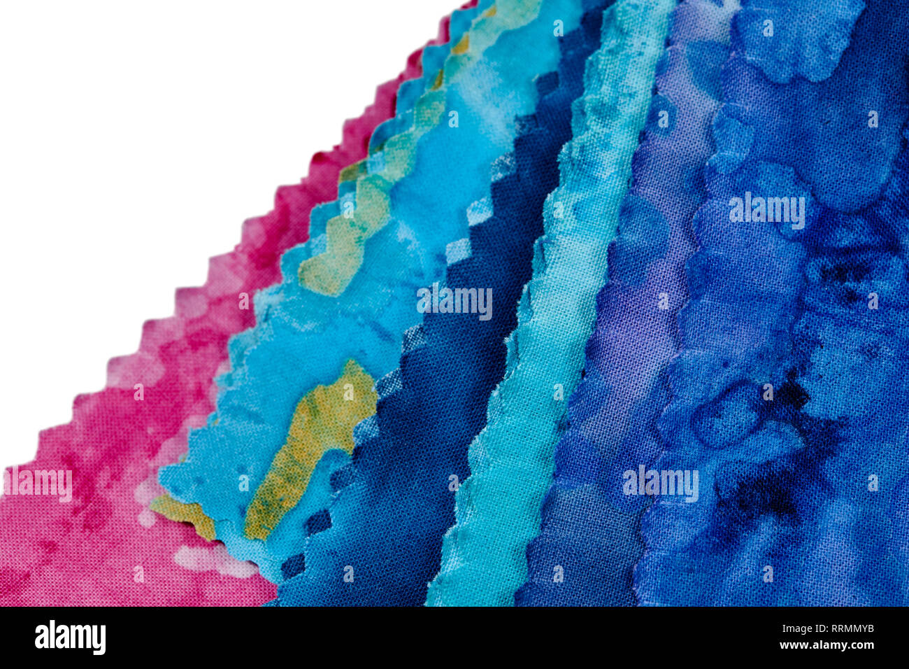 Multi-colored remnants of fabric  isolated on white Stock Photo