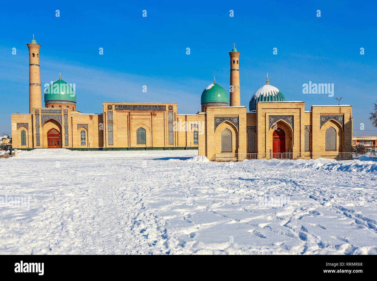 Snow and blue domes and minarets of Hazrati Imam complex, religious center of Tashkent, Uzbekistan Stock Photo