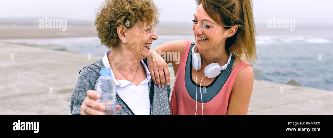 Mature women friends laughing hi-res stock photography and images - Alamy