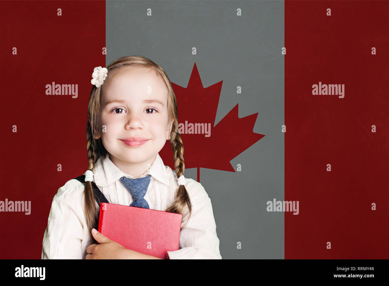 Canada concept with happy child girl in school uniform with book