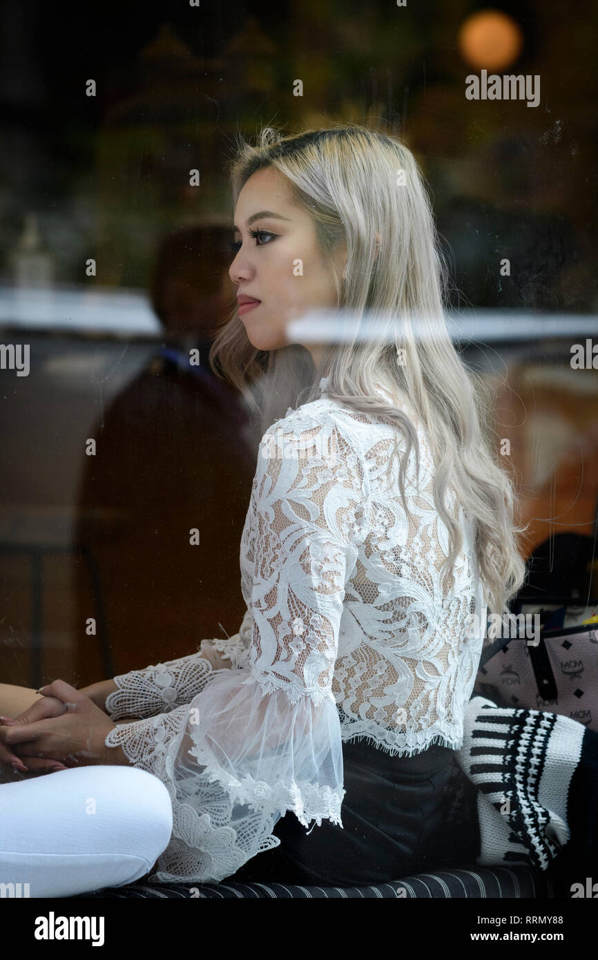 USA, America, New York, Manhattan, Astor Place, Girl in the window Stock Photo