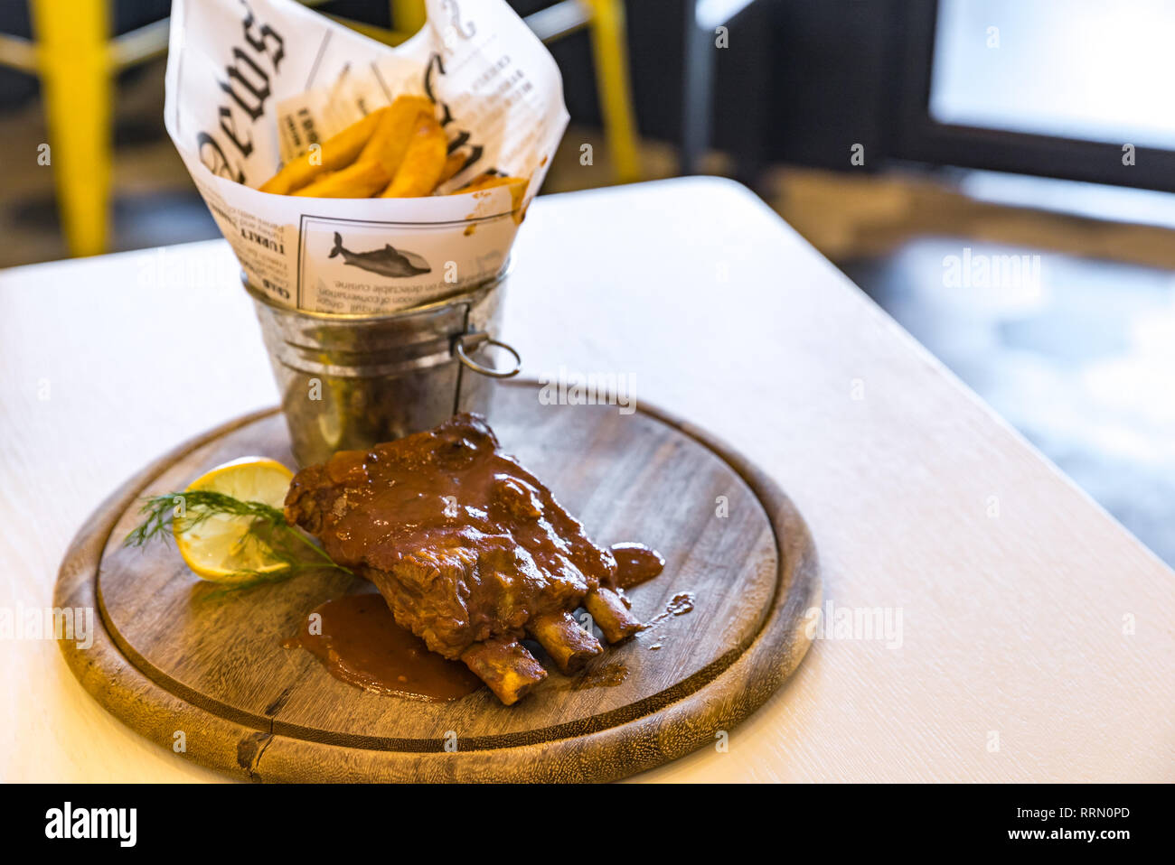 Pork Rib with Fries on wooden plate Stock Photo