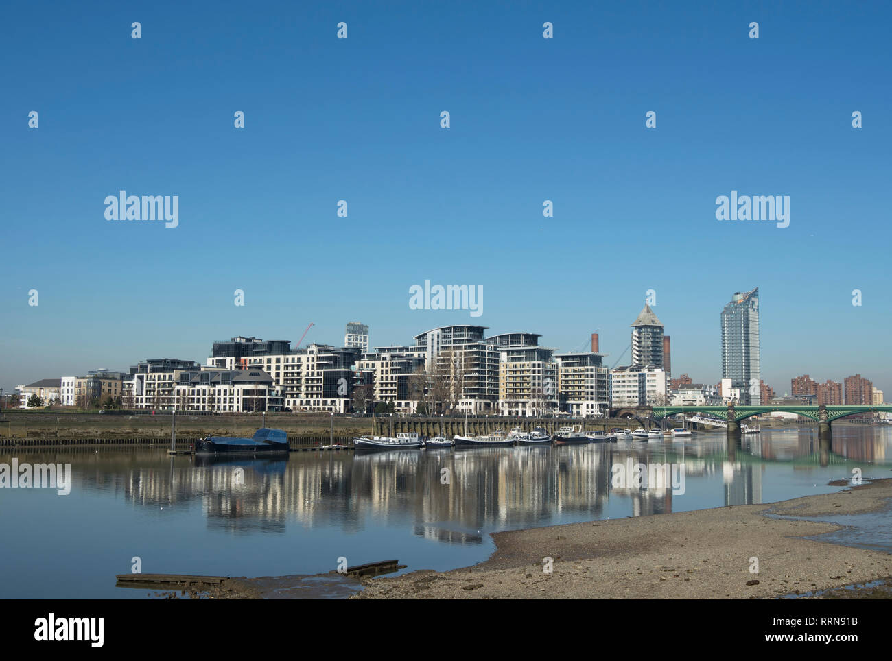 reflected in the river thames, apartments of chelsea harbour, london