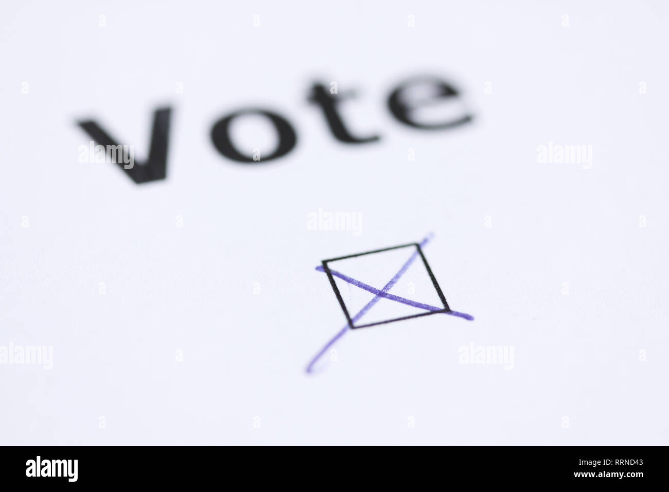 The word Vote with mark in check box with pen word blurred Stock Photo Alamy