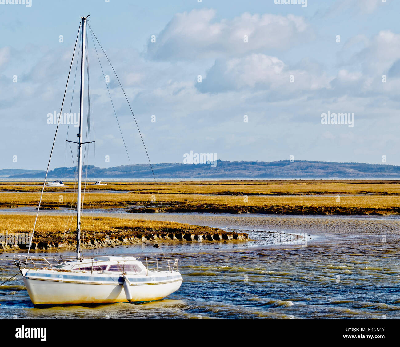 Sailing boat moored up between Keyhaven and Hurst Castle Stock Photo