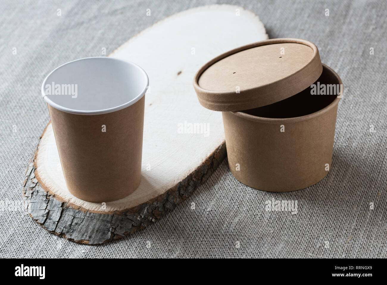 Disposable kraft paper cup on a wooden board Stock Photo - Alamy