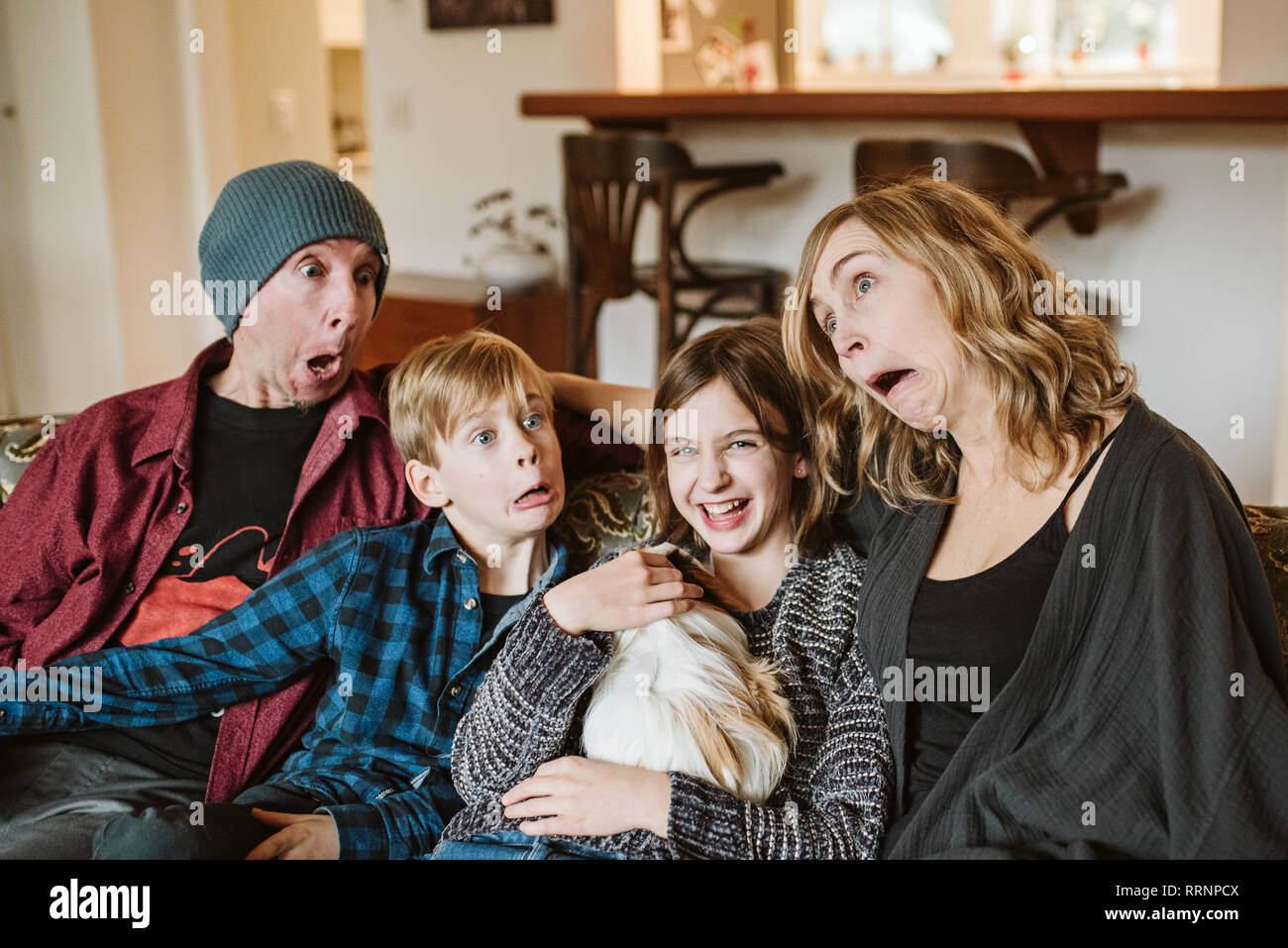 Playful, silly family making faces Stock Photo
