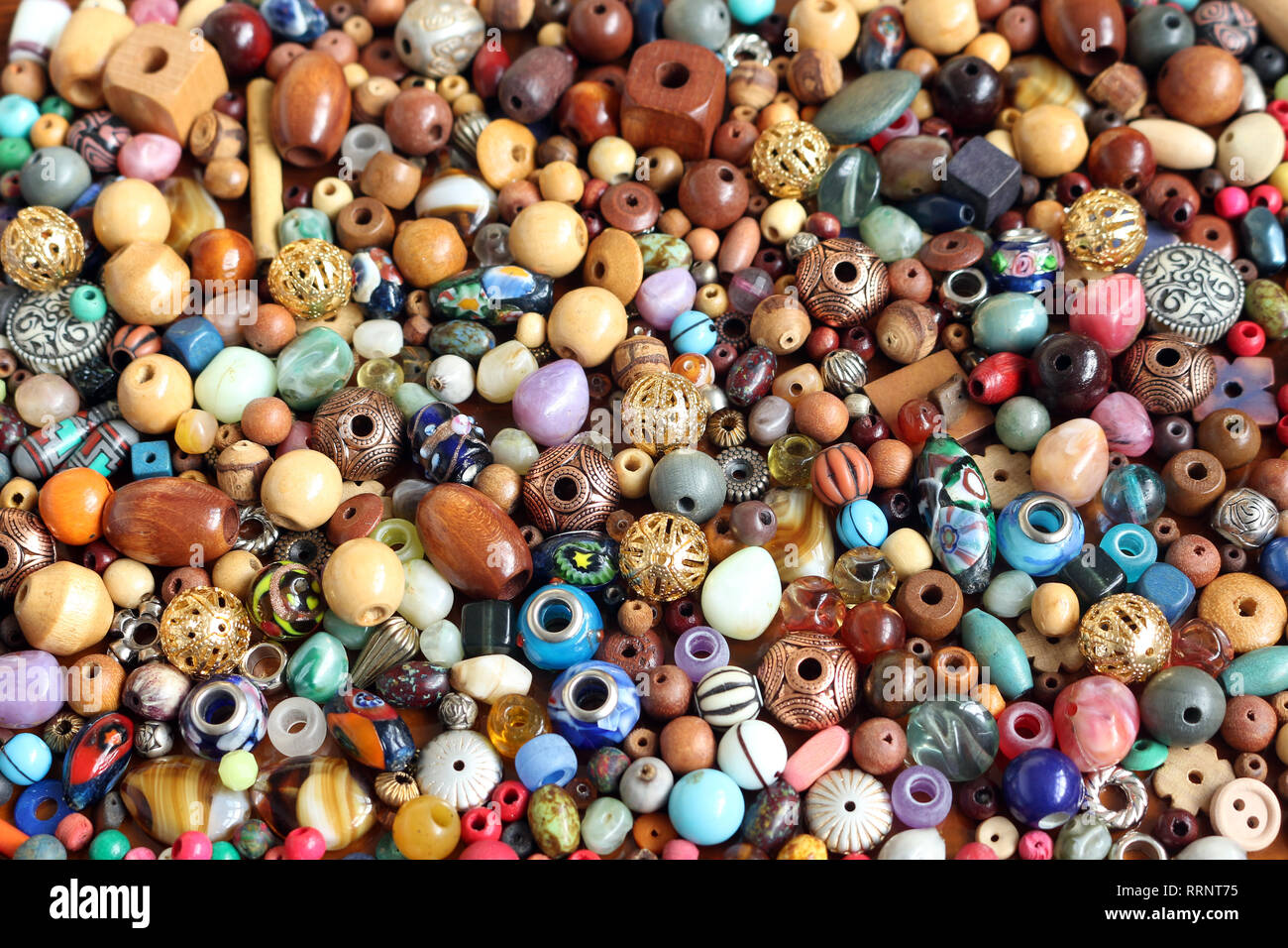 Mixed loose wooden beads for making jewellery Stock Photo - Alamy