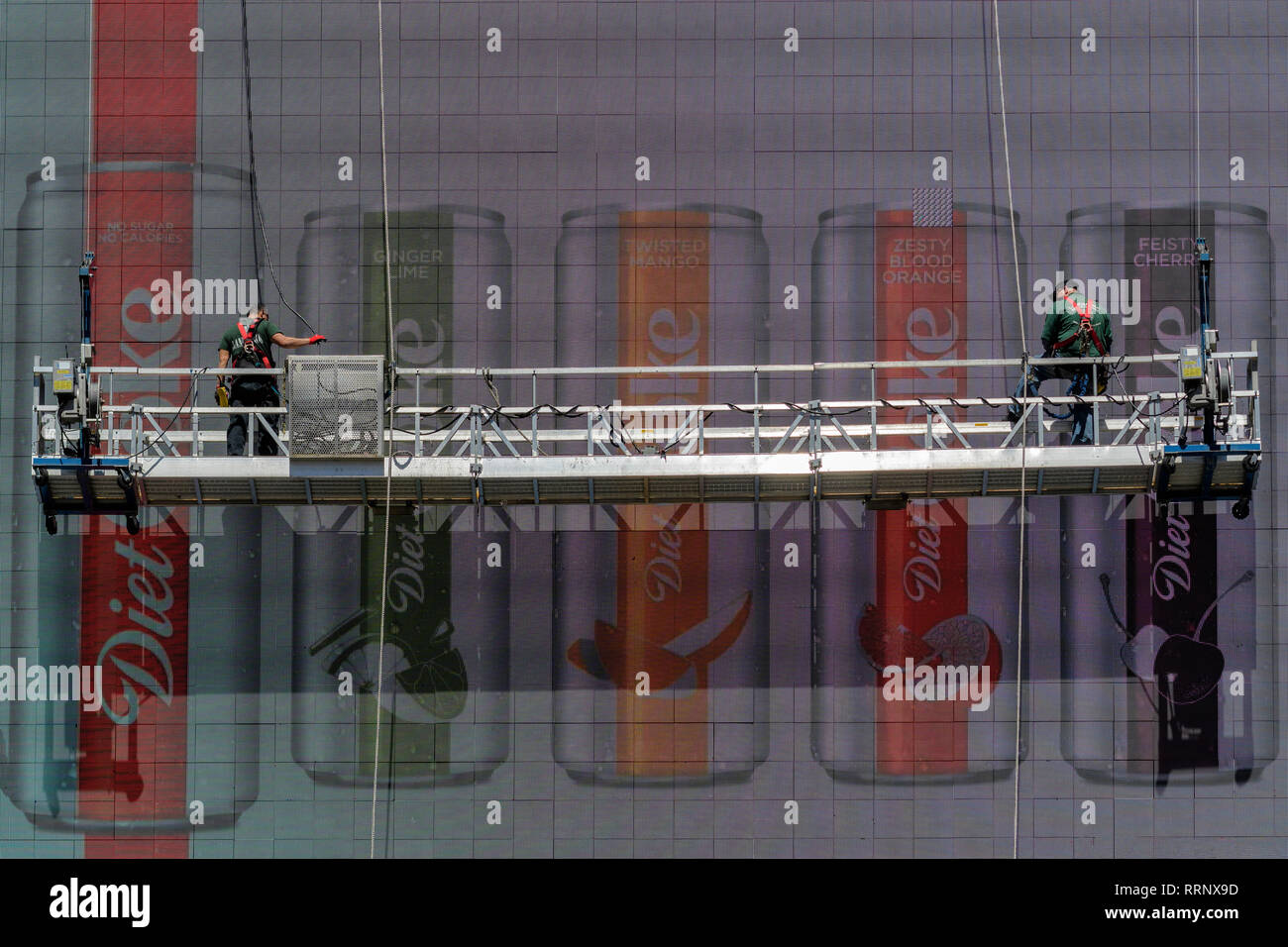 USA, American, New York, Manhattan, Times Square, Coke sign and workers Stock Photo
