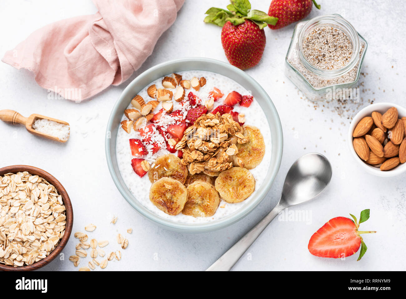 Yogurt bowl with superfoods, fruits and granola. Vegan or vegeterian breakfast, snack. Concept of clean eating, dieting, healthy eating and weight los Stock Photo