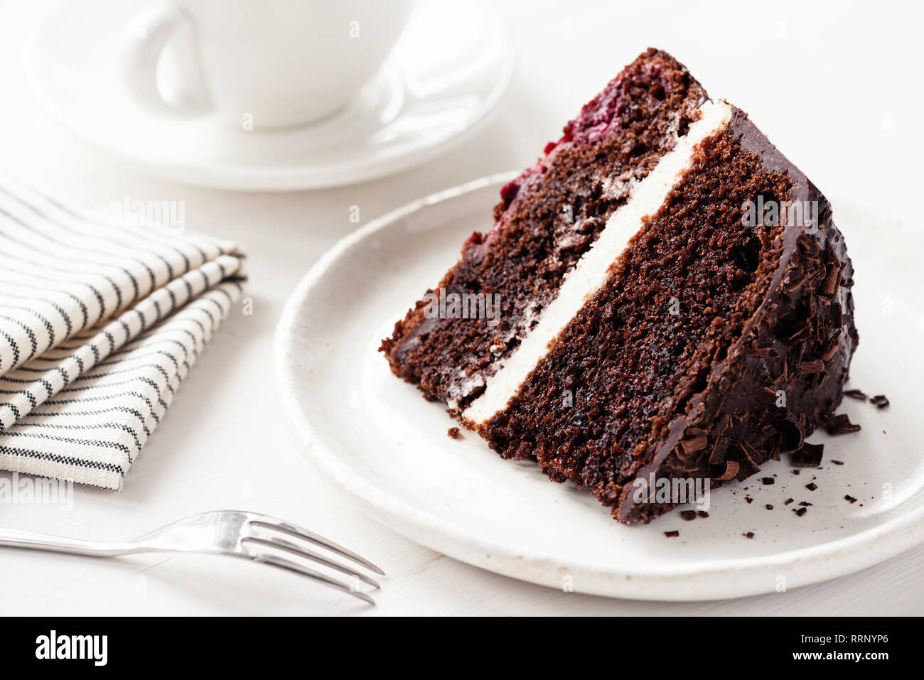 Chocolate Cake With Cream Filling Slice Of Dark Chocolate Cake On White Plate Birthday Cake Stock Photo Alamy