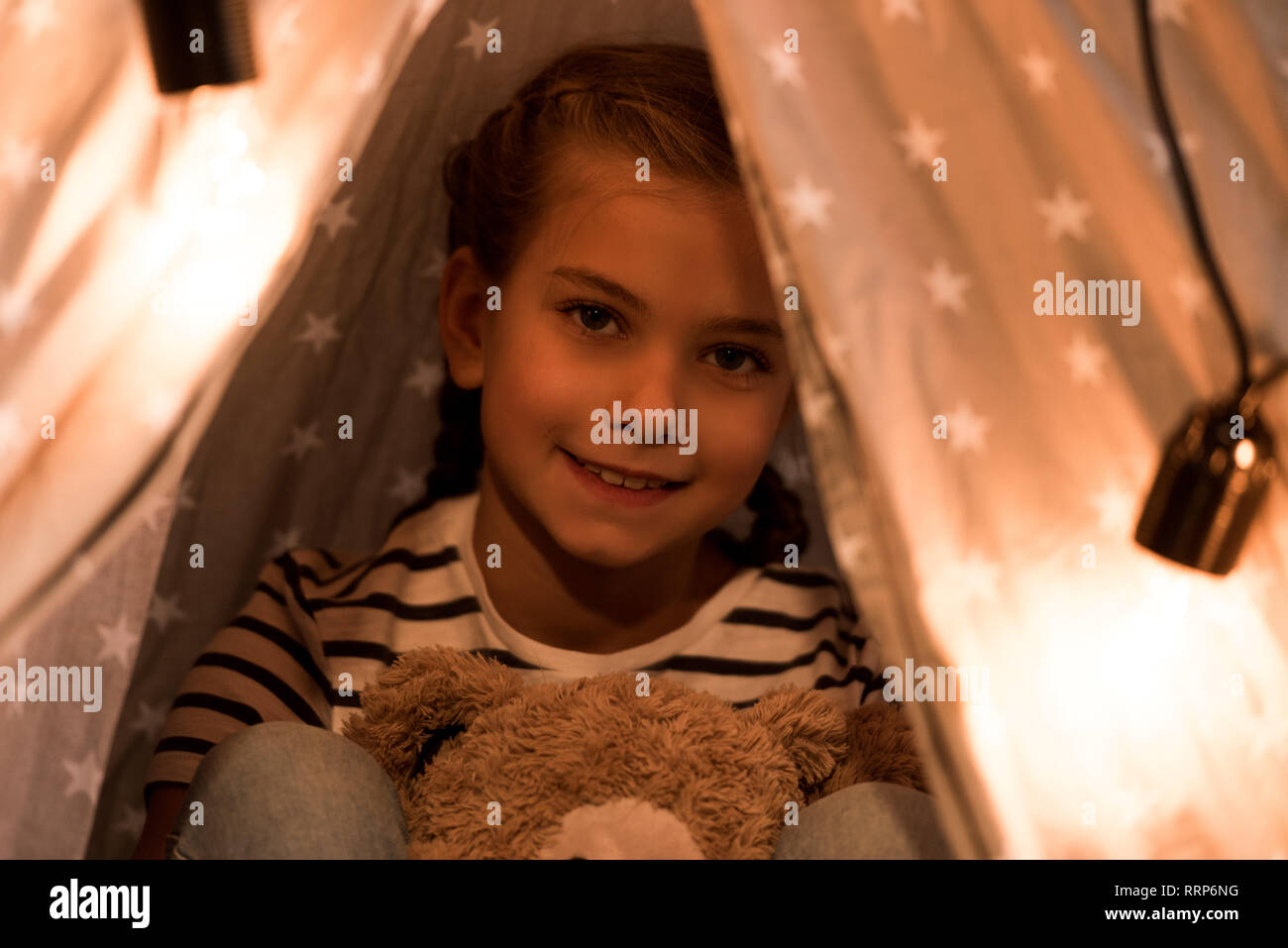 Smiling cute kid with teddy bear looking at camera Stock Photo - Alamy