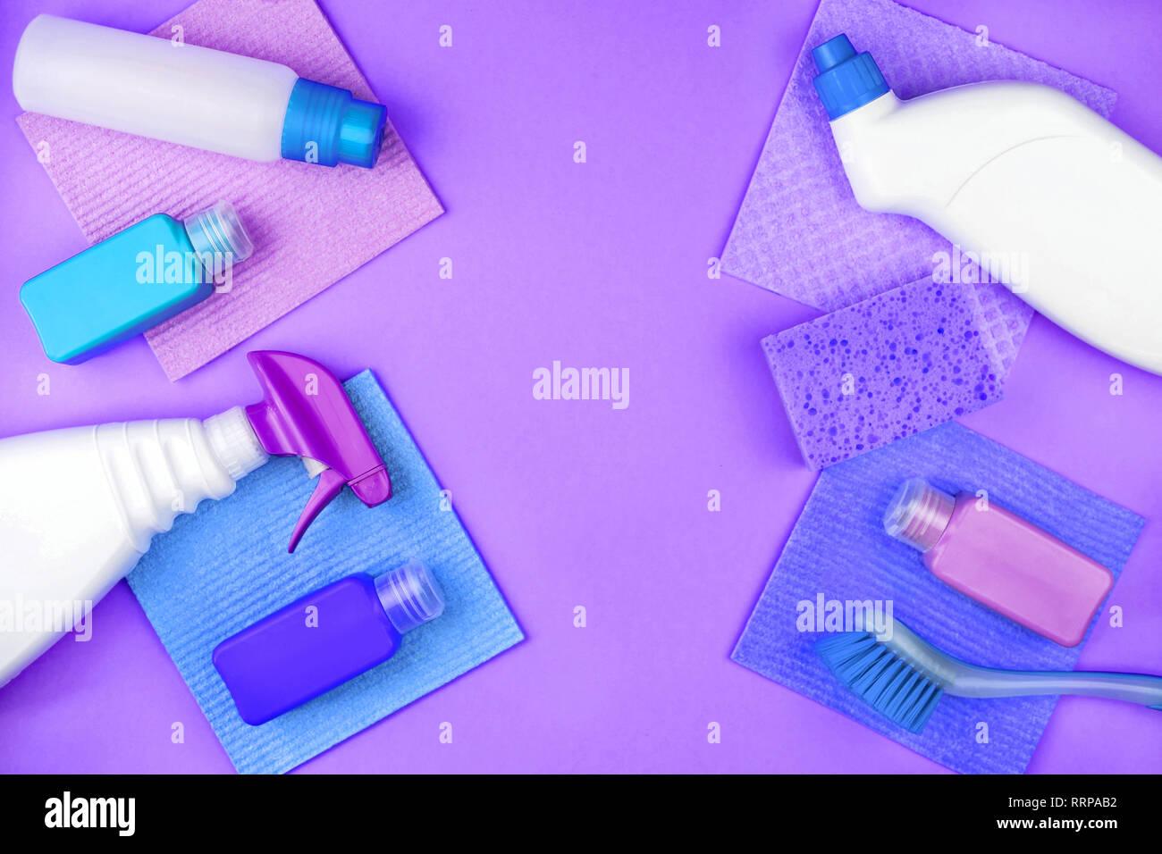 House cleaning products are on purple background Stock Photo - Alamy