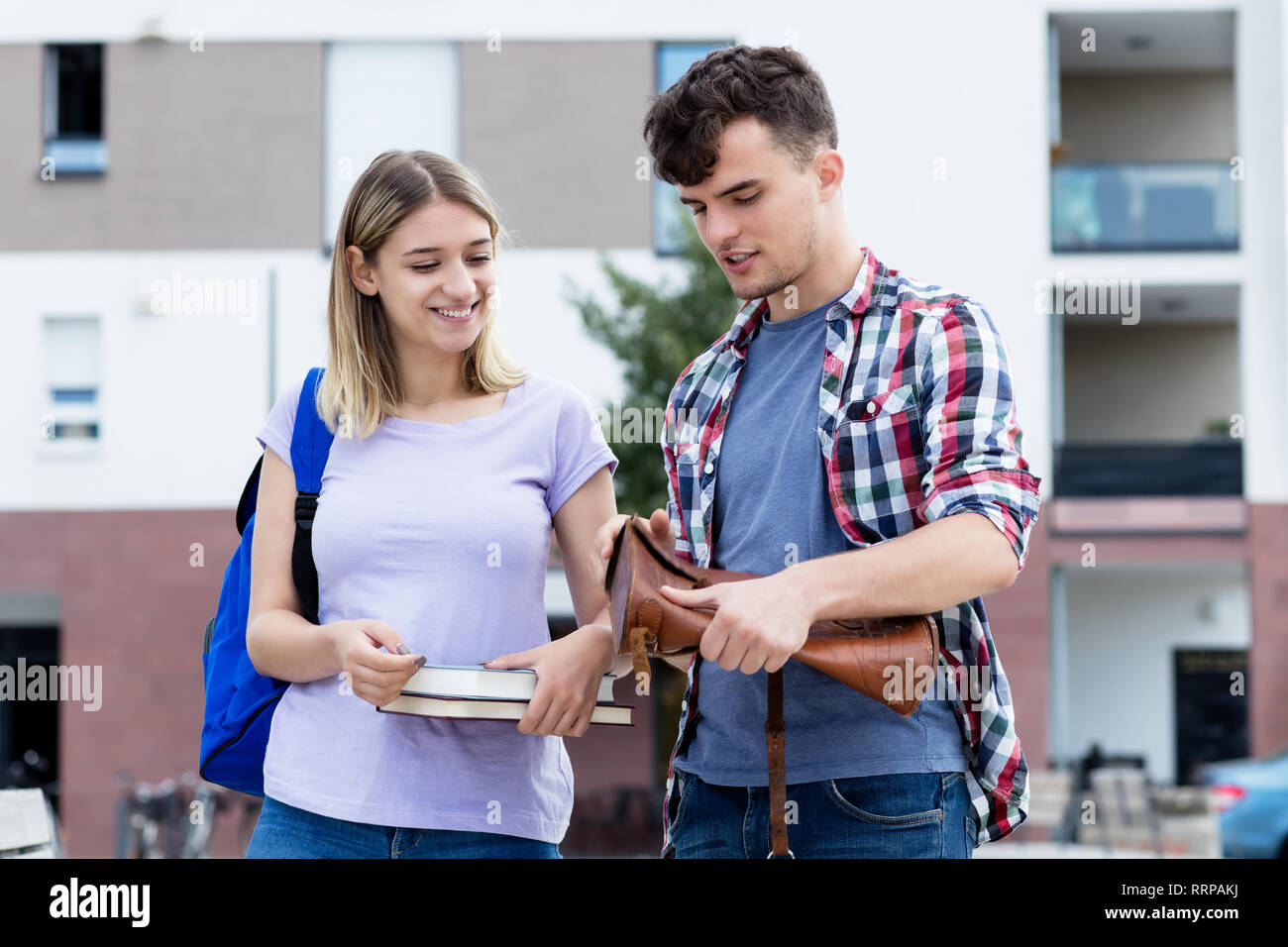Talking caucasian student couple outdoors on campus of university Stock ...