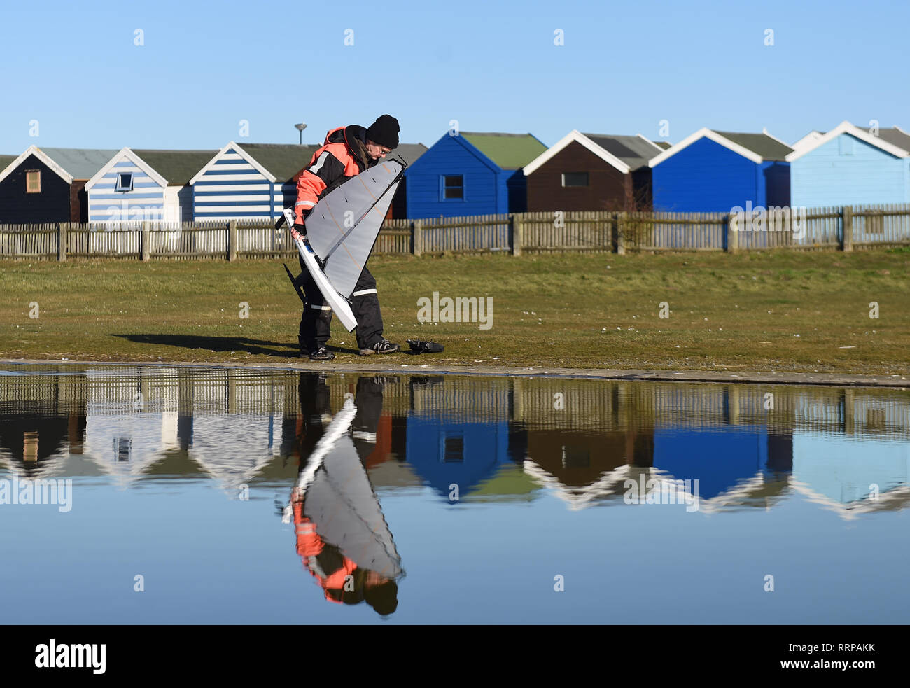 A man retrieves his model yacht from the boating lake at Southwold in Suffolk, as Britain could experience more record-breaking temperatures this week. PRESS ASSOCIATION The UK has experienced its warmest winter day since records began with temperatures hitting 20.8C in Porthmadog, Gwynedd, west Wales on Tuesday as Britain could experience more record-breaking temperatures this week. See PA story WEATHER Warm. Photo credit should read: Joe Giddens/PA Wire Stock Photo