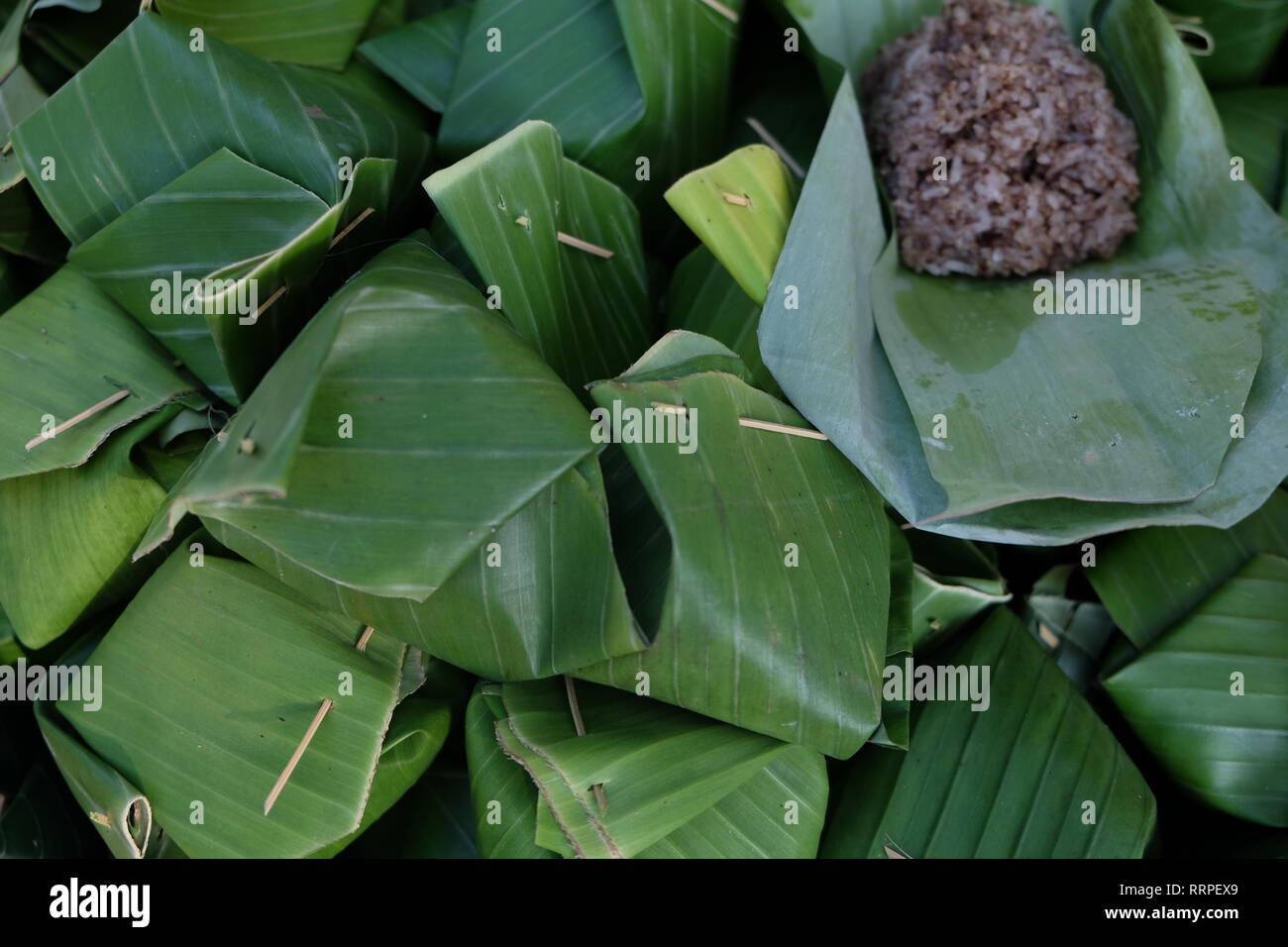 Banana leaf wrapped rice, thai food Stock Photo Alamy