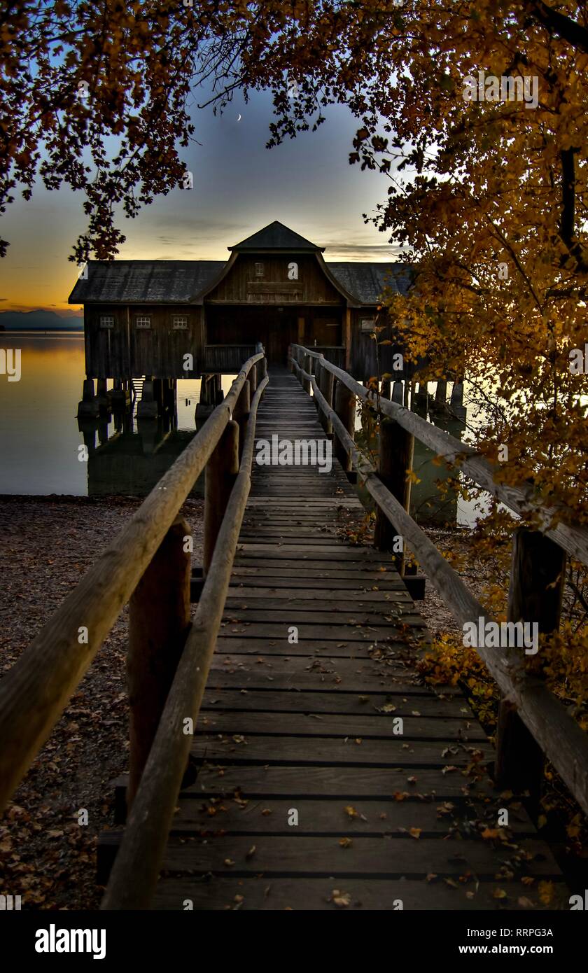 Wooden pier leading into lake hi-res stock photography and images - Alamy