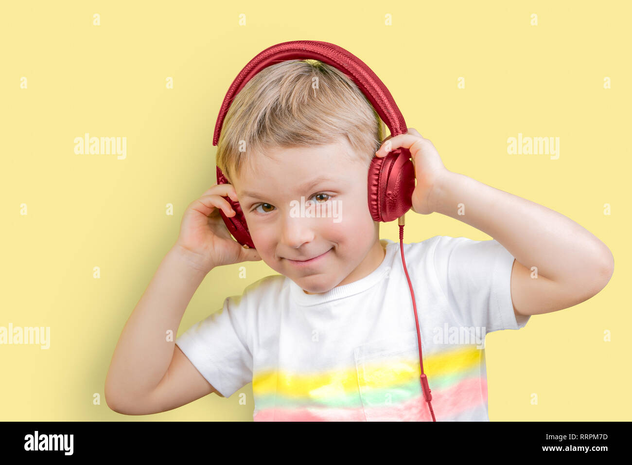 Young boy listening to headphones Stock Photo