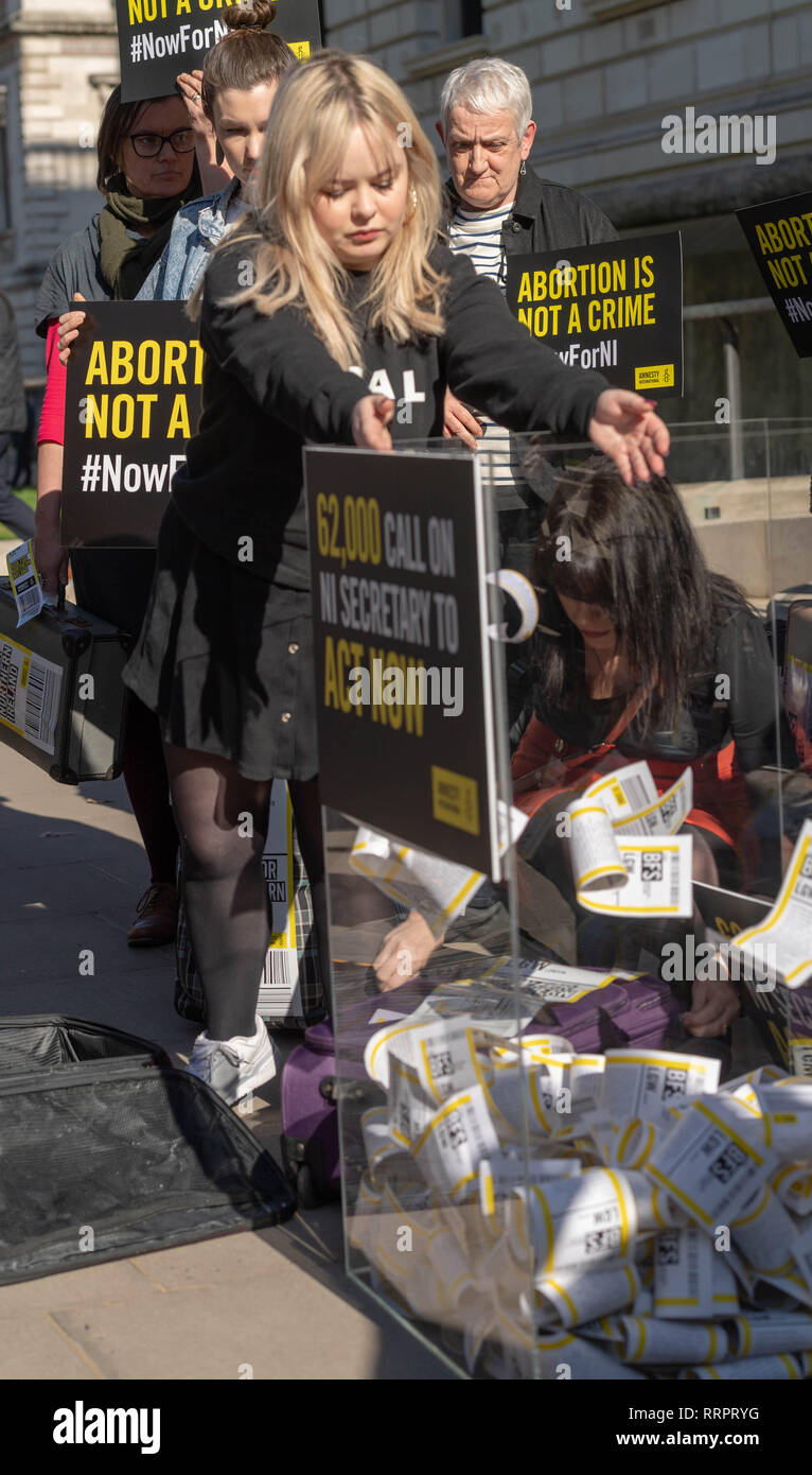 London, UK. 26th February, 2019. A march supporting decriminalisation abortion in Northern Ireland  took place today including handing in a petition to the Northern Ireland Office.  The march was supported by cross party MP's and two actors from Derry Girls, Nocola Coughlan loads a box with the petition    Credit Ian Davidson/Alamy Live News Stock Photo