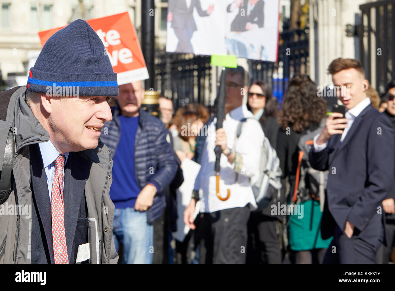 London, UK. 26th Feb, 2019. UK Conservative party politician and Leave supporter Boris Johnson passes Brexit campaigners on his way into Parliament. Credit: Kevin J. Frost/Alamy Live News Stock Photo