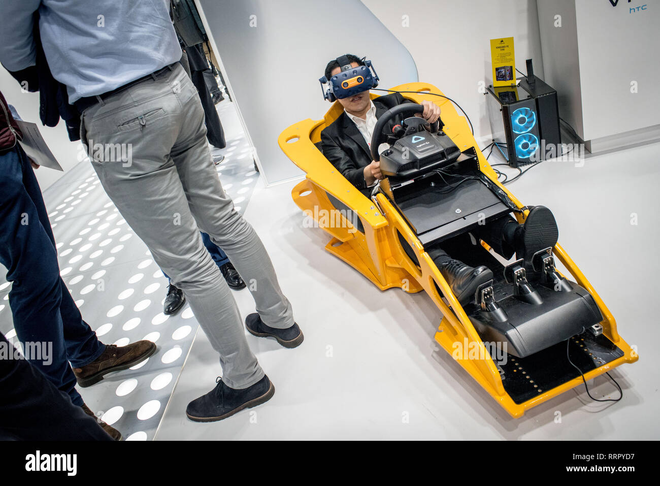 February 26, 2019 - Barcelona, Catalonia, Spain - An attendee tries a  Logitech VR racing car during the GSMA Mobile World Congress 2019 in  Barcelona, the world's most important event on communication
