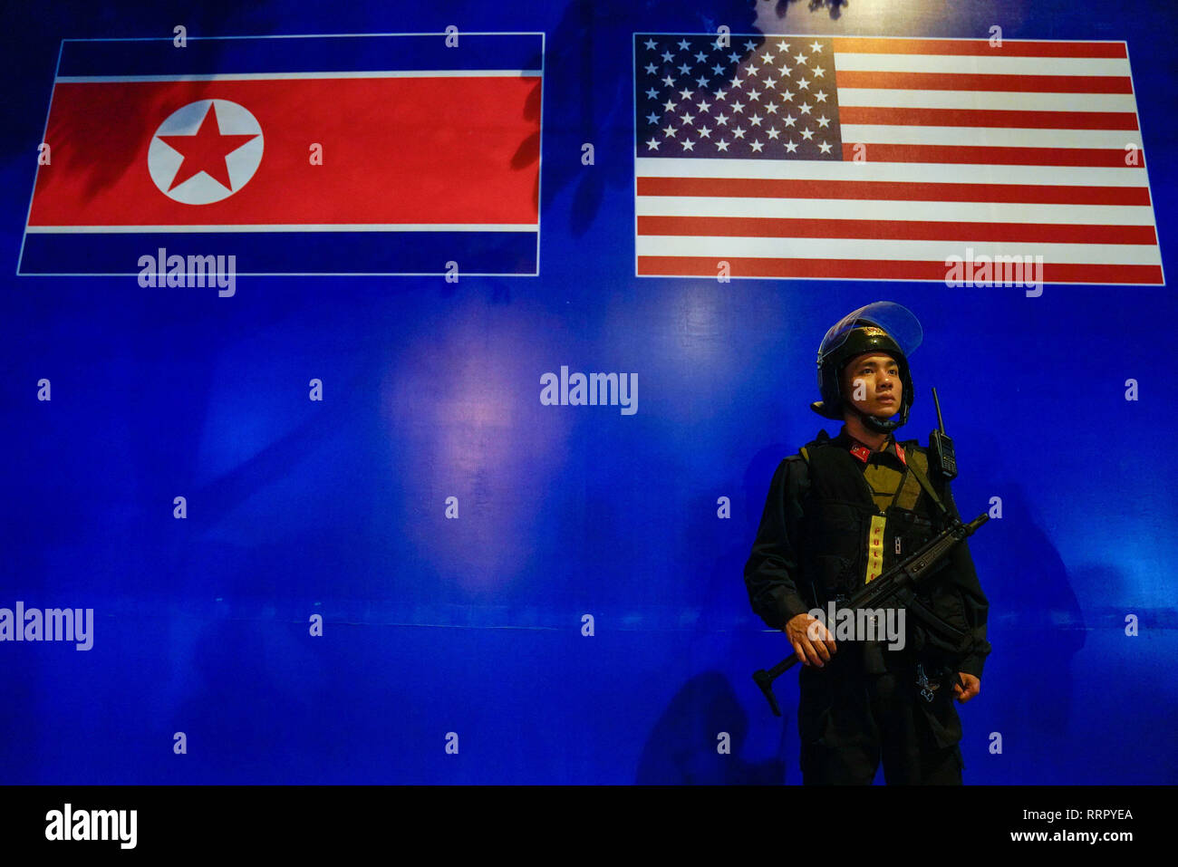Hanoi, Vietnam. 27th Feb, 2019. A armed police officer stands guard in front of the DPRK-USA Hanoi Summit sign board ahead of the Trump Kim two-day summit from February 27-28. Credit: Christopher Jue/ZUMA Wire/Alamy Live News Stock Photo