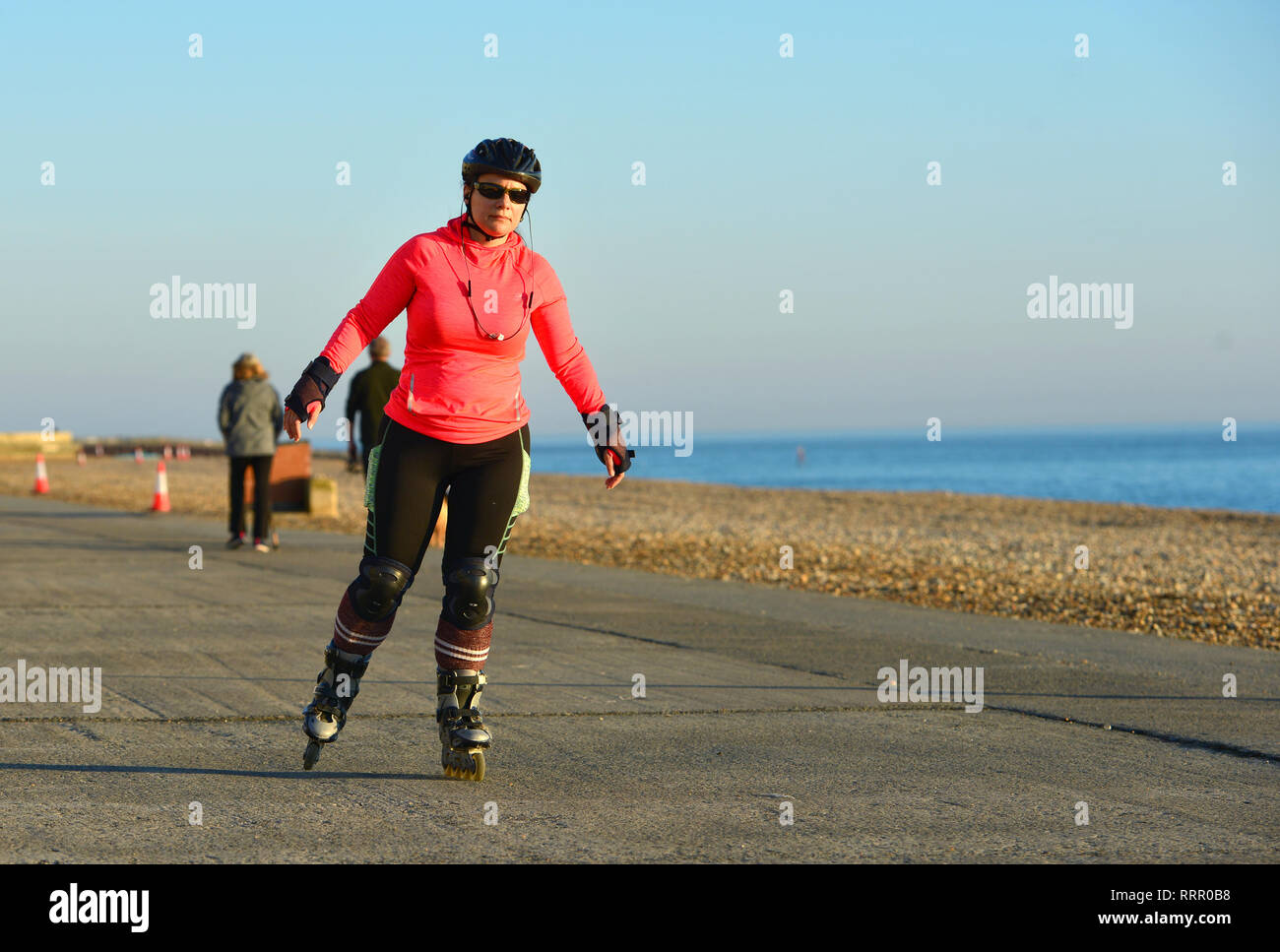 Seaford, East Sussex, UK. 26th Feb, 2019. People enjoying the warm sun in Seaford, East Sussex, on the hottest winter day on record. Credit: Peter Cripps/Alamy Live News Stock Photo