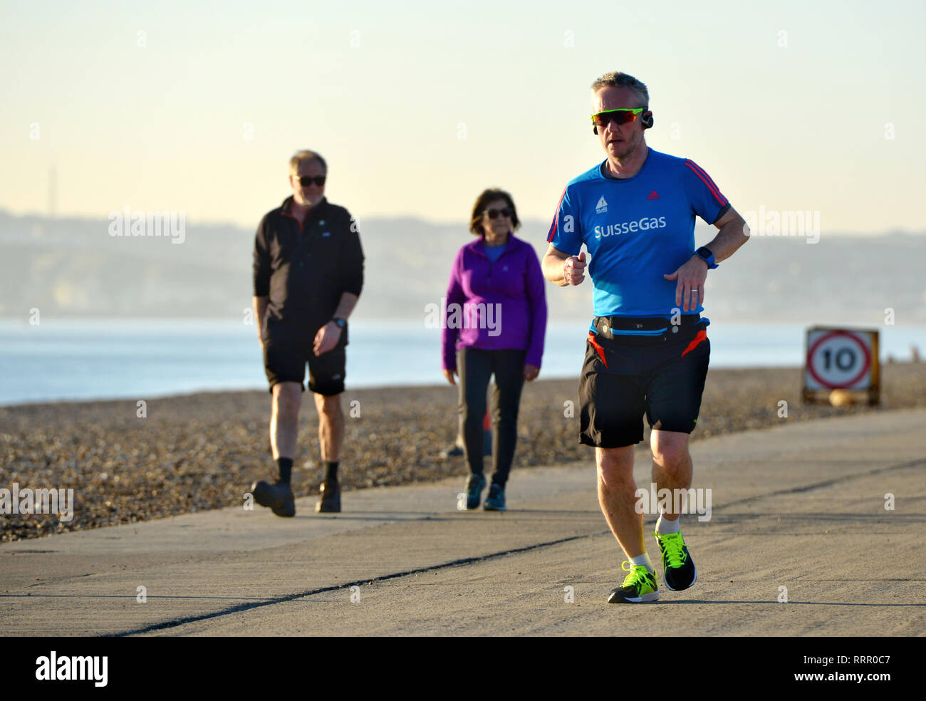 Seaford, East Sussex, UK. 26th Feb, 2019. People enjoying the warm sun in Seaford, East Sussex, on the hottest winter day on record. Credit: Peter Cripps/Alamy Live News Stock Photo