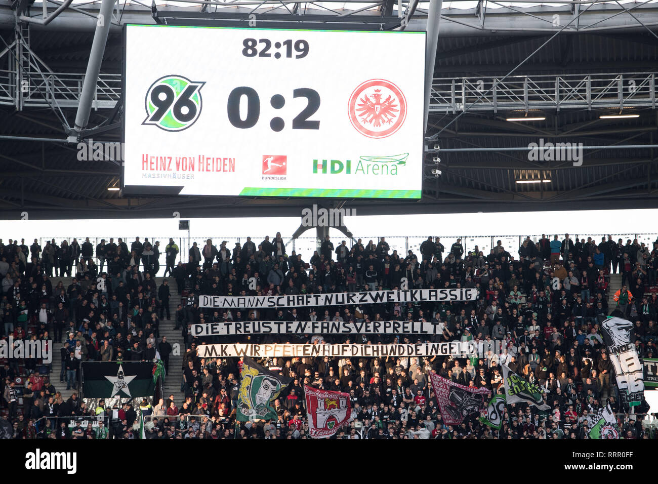 Hanoverian fans holding banner with the inscription: 'The team only second-rate, the most loyal fans bounced, MK (Martin Kind) We whistle to you and your money', protest, fan, fans, spectators, supporters, supporters, football 1. Bundesliga, 23. matchday, Hanover 96 (H) - Eintracht Frankfurt (F) 0: 3, on 24/02/2019 in Hannover/Germany. ¬ | usage worldwide Stock Photo