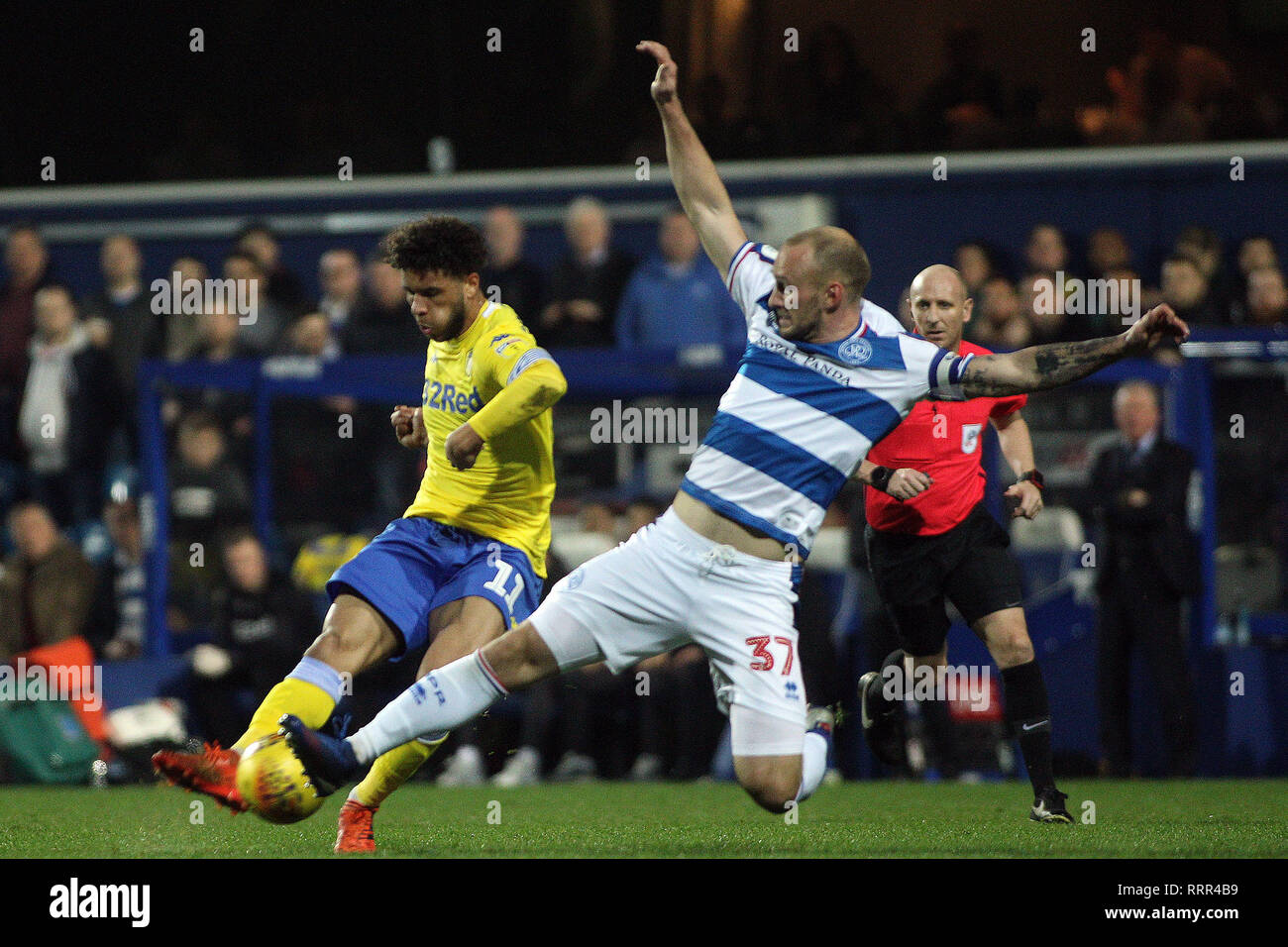 London, UK. 26th Feb, 2019. Tyler Roberts of Leeds United (L) is tackled by Toni Leistner of Queens Park Rangers (R). EFL Skybet championship match, Queens Park Rangers v Leeds United at Loftus Road Stadium in London on Tuesday 26th February 2019. this image may only be used for Editorial purposes. Editorial use only, license required for commercial use. No use in betting, games or a single club/league/player publications. pic by Steffan Bowen/Andrew Orchard sports photography/Alamy Live news Credit: Andrew Orchard sports photography/Alamy Live News Stock Photo