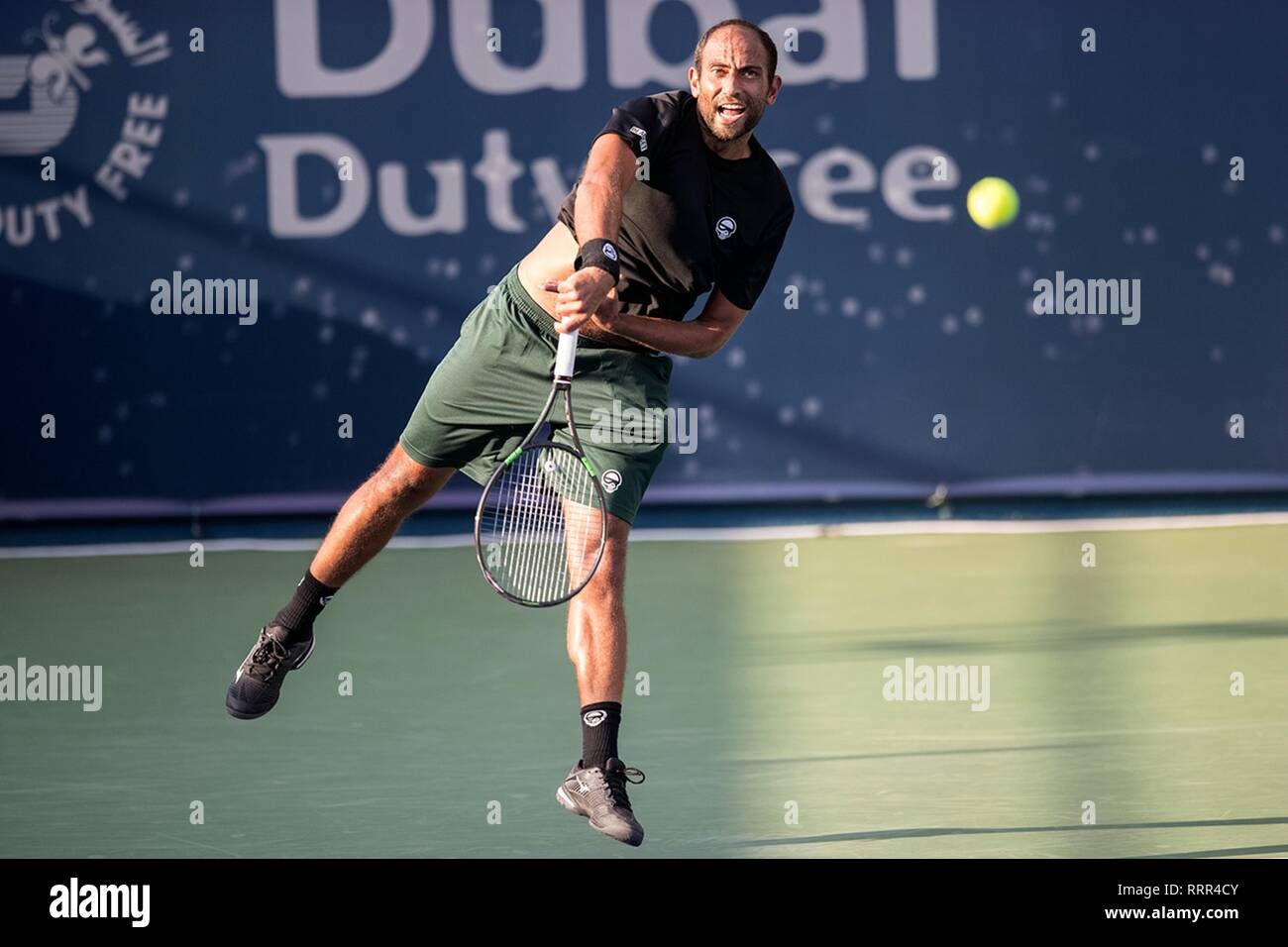 Dubai, United Arab Emirates. 26th Feb, 2019. Mohamed Safwat of Egypt serves  during the singles first round match between Marcos Baghdatis of Cyprus and  Mohamed Safwat of Egypt at the ATP Dubai