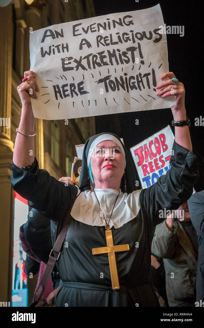 Protesters from Class War anarchist group hold a lively demonstration outside the London Palladium theatre against the evening talk featuring Jacob Rees-Mogg, Conservative MP and prominent Brexit supporter. Class War members, including long-time anarchist, Ian Bone, Jane Nicholl (pictured dressed as a nun) and Adam Clifford (as Rees-Mogg parody) claim Mr Rees-Mogg, a Catholic, is a religious extremist because of his outspoken views on abortion. Stock Photo