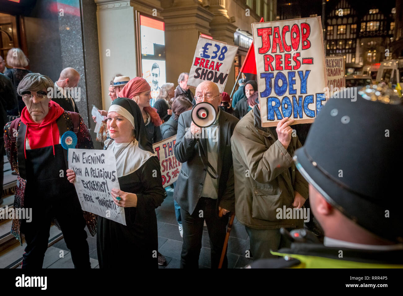 Protesters from Class War anarchist group hold a lively demonstration outside the London Palladium theatre against the evening talk featuring Jacob Rees-Mogg, Conservative MP and prominent Brexit supporter. Class War members, including long-time anarchist, Ian Bone (with megaphone), Jane Nicholl (dressed as a nun) and Adam Clifford (as Rees-Mogg parody) claim Mr Rees-Mogg, a Catholic, is a religious extremist because of his outspoken views on abortion. Stock Photo