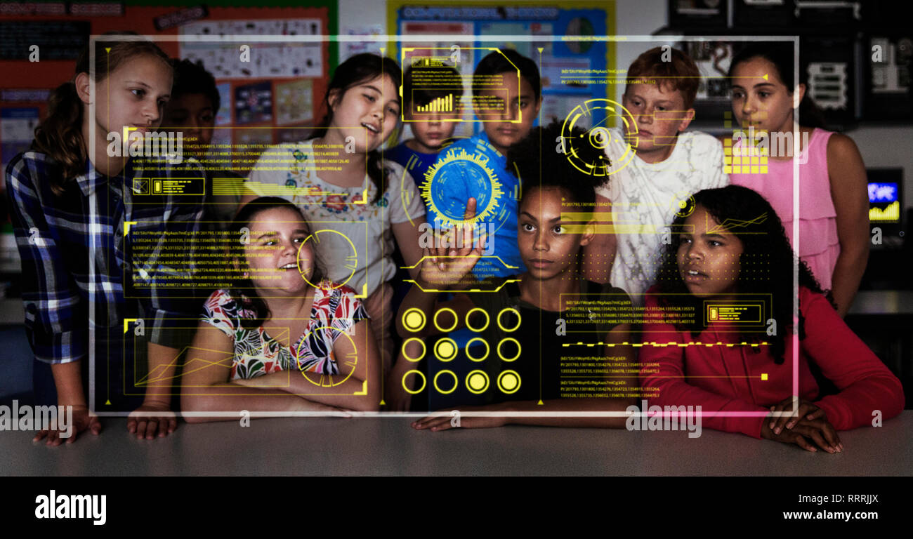 Junior high school students using futuristic touch screen in classroom Stock Photo