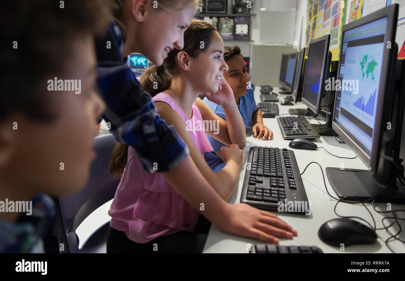 Junior high school students using computer in classroom Stock Photo