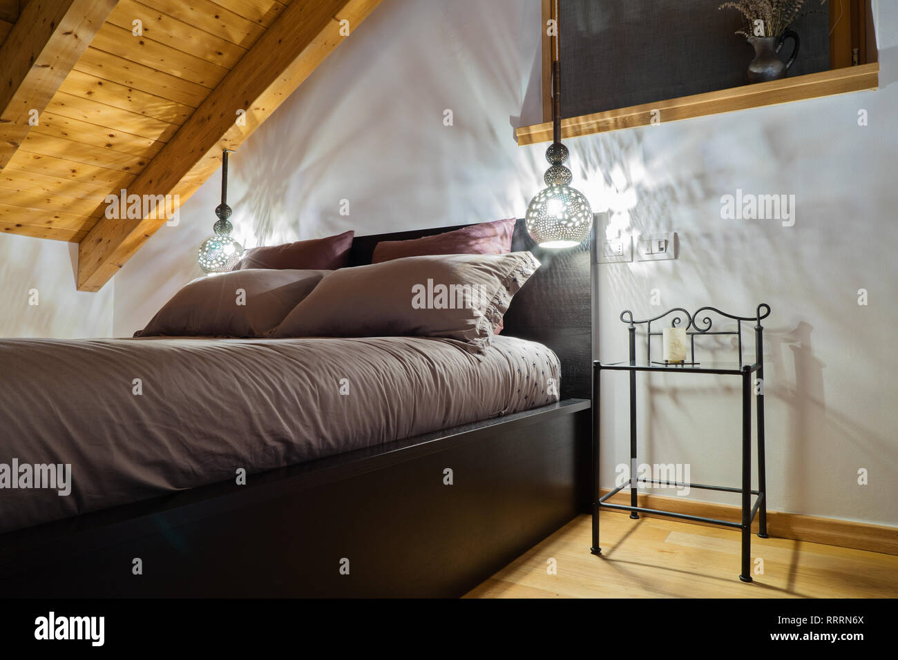 Mansard Cozy Bedroom In Rustic Style With Oriental Lamps Stock Photo Alamy